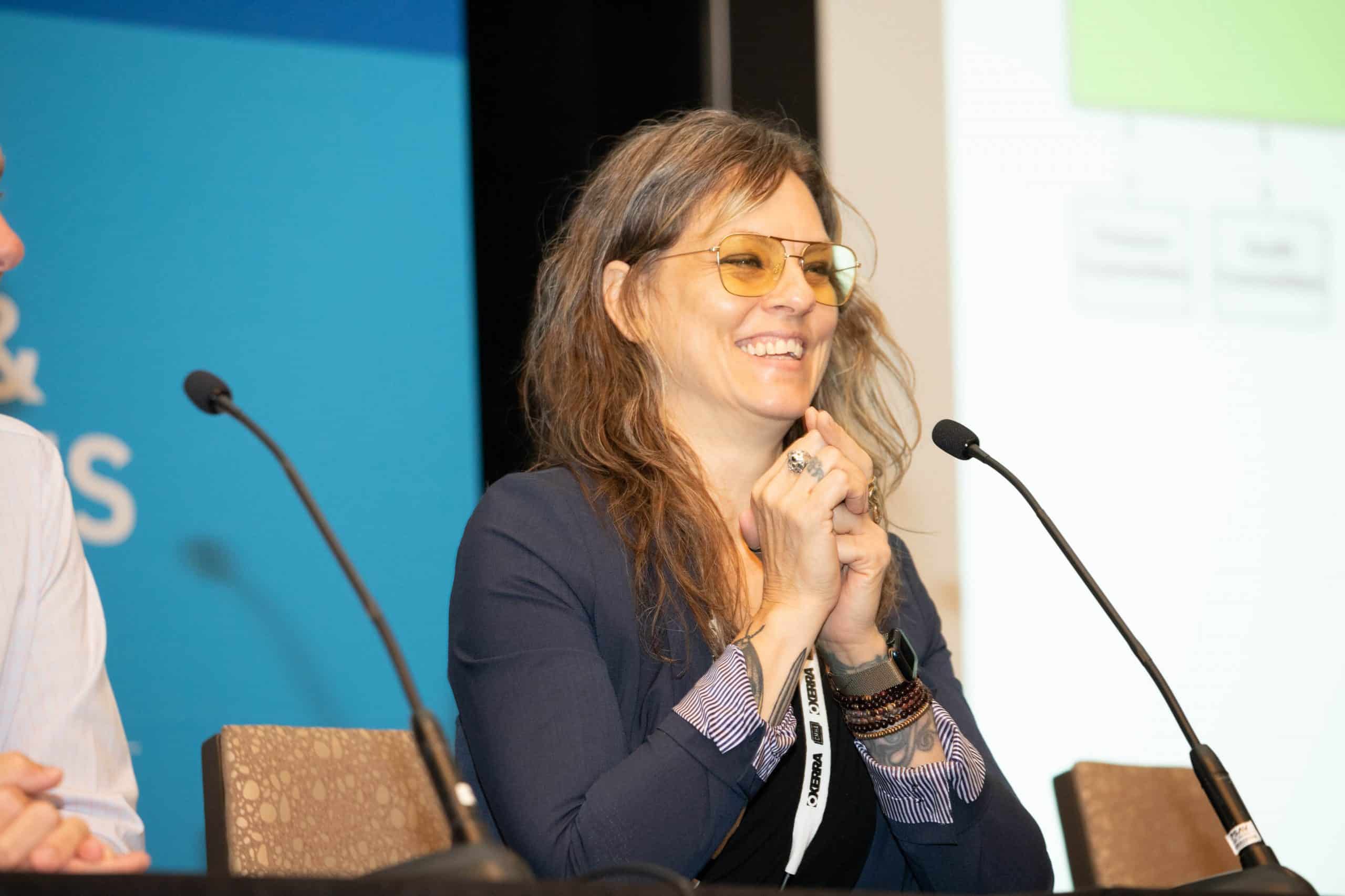 Woman speaker presenting at event
